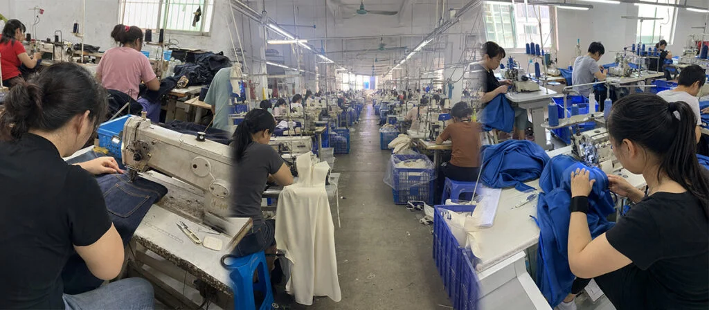 Rows of sewing operators stitching blue and black garments on a long factory floor.
