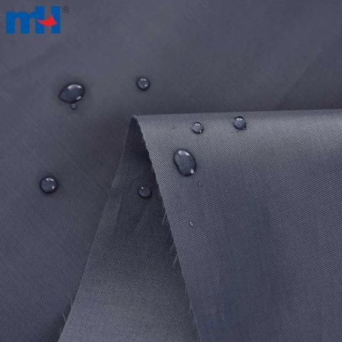 Dark PU-coated oxford fabric with water droplets beading on its surface.