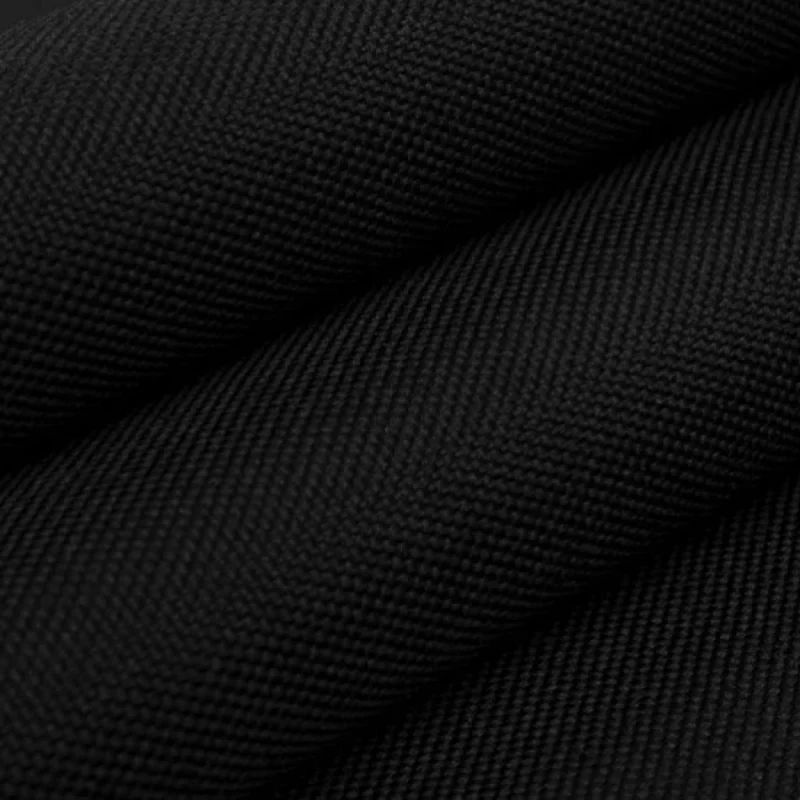 Folded black 600D fabric shown close up.