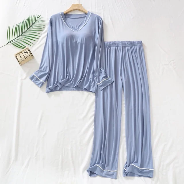 A light blue modal pajama set with a long-sleeve top and pants, laid flat on white.