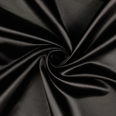 Black polyester satin twisted into glossy folds.