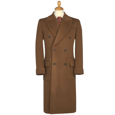 A chestnut double-breasted polo coat with broad lapels, flapped patch pockets and turned-back cuffs.