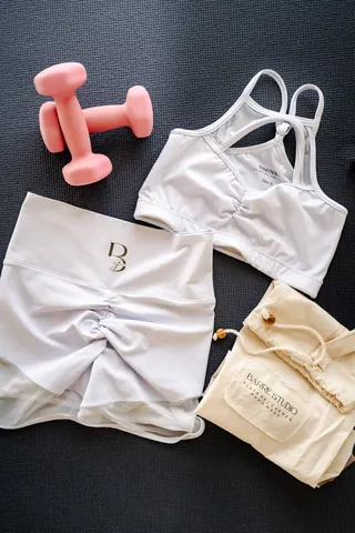 Sportswear laid flat with leggings and shorts.