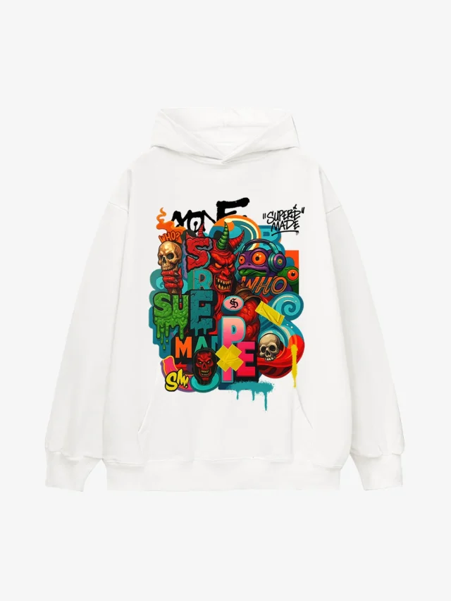 A white hoodie with a dense multicolor print of lettering, skulls and paint drips across the front.