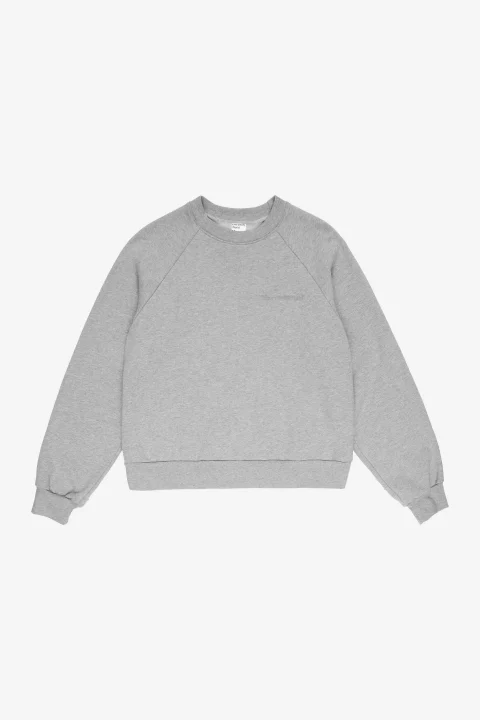 A heather gray raglan sweatshirt with diagonal seams from the collar to the underarms.