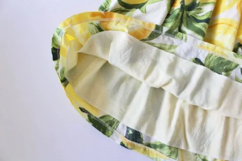 Inside a gathered skirt, with a pale lining attached below the waistband.