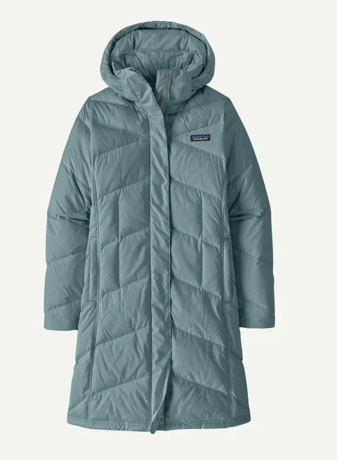 A muted blue-green knee-length puffer coat with a hood and chevron-shaped channels.