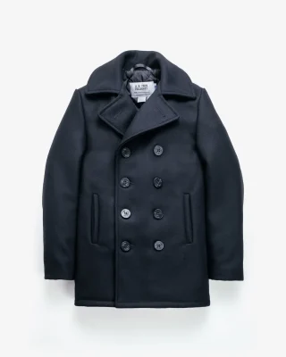 A navy peacoat with wide lapels, two rows of dark buttons and a short straight hem.