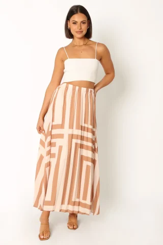 A tan and cream pleated midi skirt with a geometric print.