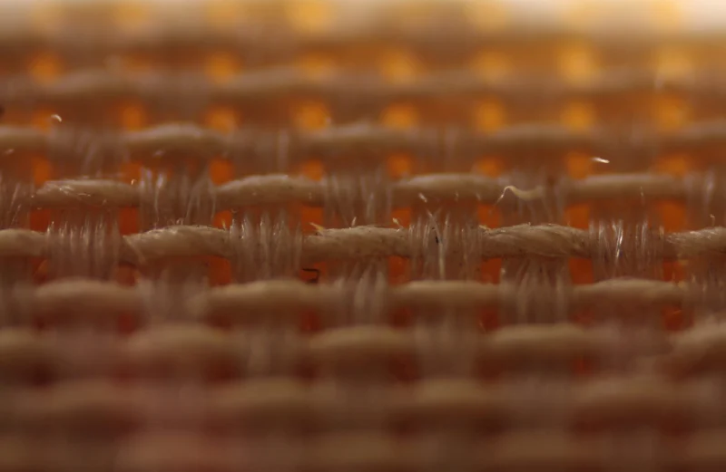 Close-up of thick yarns in a plain weave.