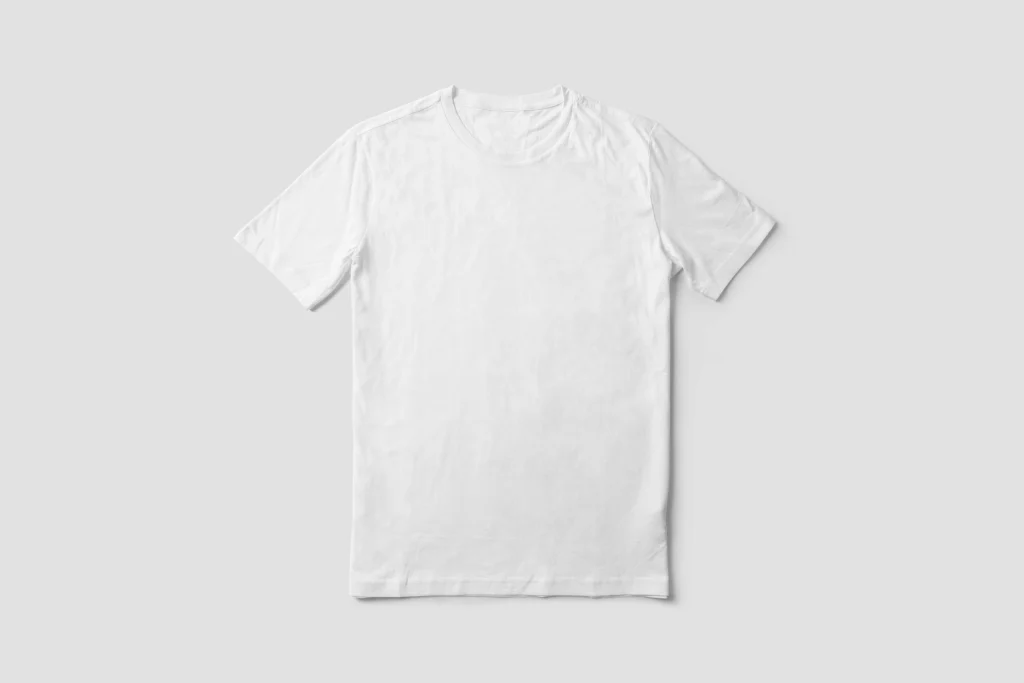 A plain white oversized T-shirt laid flat on a gray background.