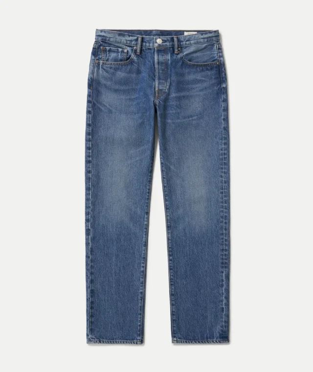 Mid-blue straight-leg jeans with a button fly, laid flat on a white background.