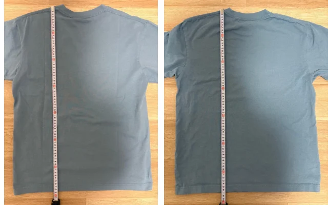 Two blue T-shirts laid flat, each with a ruler along the body length.