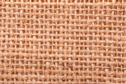 A close-up of coarse, open jute weave.